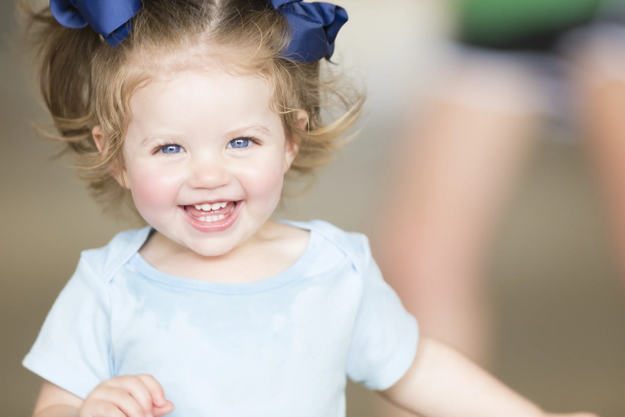 Cute toddler girl laughing and smiling